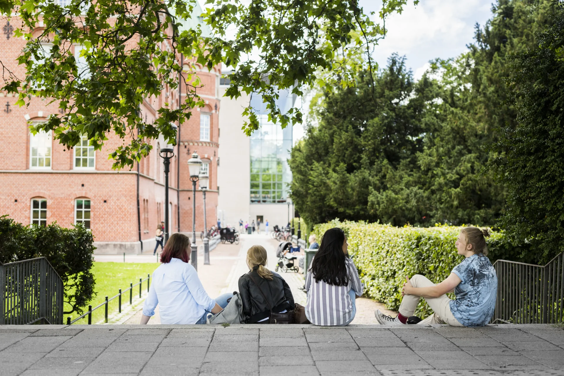 Students Sitting On Stairs Outside Library During 2024 10 18 06 42 51 Utc